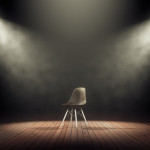 83226379 - spotlights illuminate empty stage with chair in dark background. 3d rendering