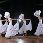 Cabaret.Girls dance variety show. Dancers in white dresses perform modern dance cabaret